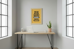 Framed motivational quote on a yellow background