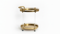 Gold serving cart with clear acrylic sides on a white background