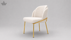 Beige chair with gold legs on a gray background