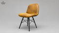 Brown leather chair with black metal legs on a gray background