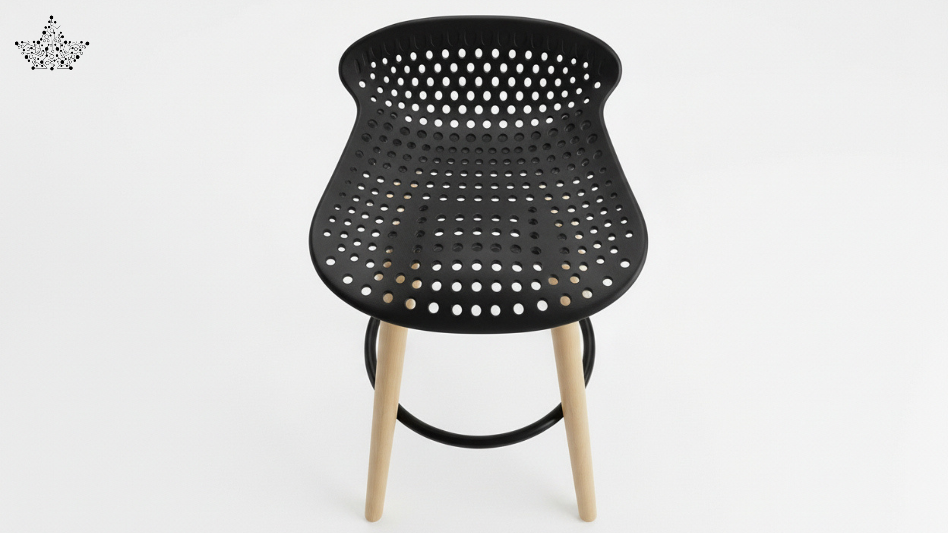 Black perforated stool with wooden legs on a white background