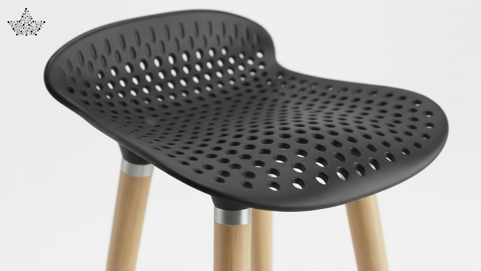Black perforated stool with wooden legs on a white background