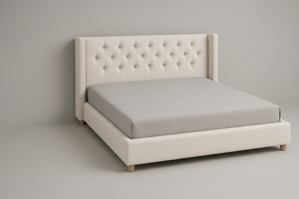 Beige upholstered bed with tufted headboard and matching nightstands on a gray background