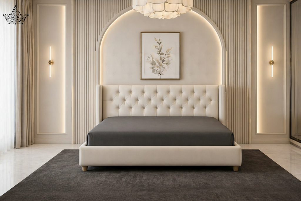 Luxurious bedroom with a tufted bed, nightstands, and wall art.