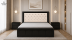 Modern bedroom with a black bed frame, white mattress, and decorative wall art.