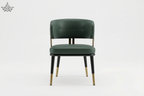 Green chair with gold accents on a white background