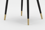Blue upholstered chair with black legs and gold feet on a white background