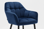 Blue velvet chair with gold legs on a white background