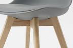 Gray chair with wooden legs on a white background