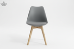 Gray chair with wooden legs on a white background