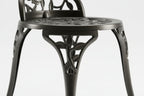 Decorative chair with intricate cut-out design on a white background