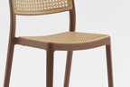 Chair with woven backrest and seat on a white background