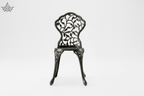 Decorative black metal chair on a white background
