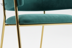 Teal chair with gold legs on a white background