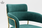 Teal chair with gold legs on a white background