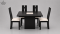 Black dining table with four matching chairs on a gray background