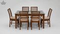 Dining table set with six wooden chairs on a white background