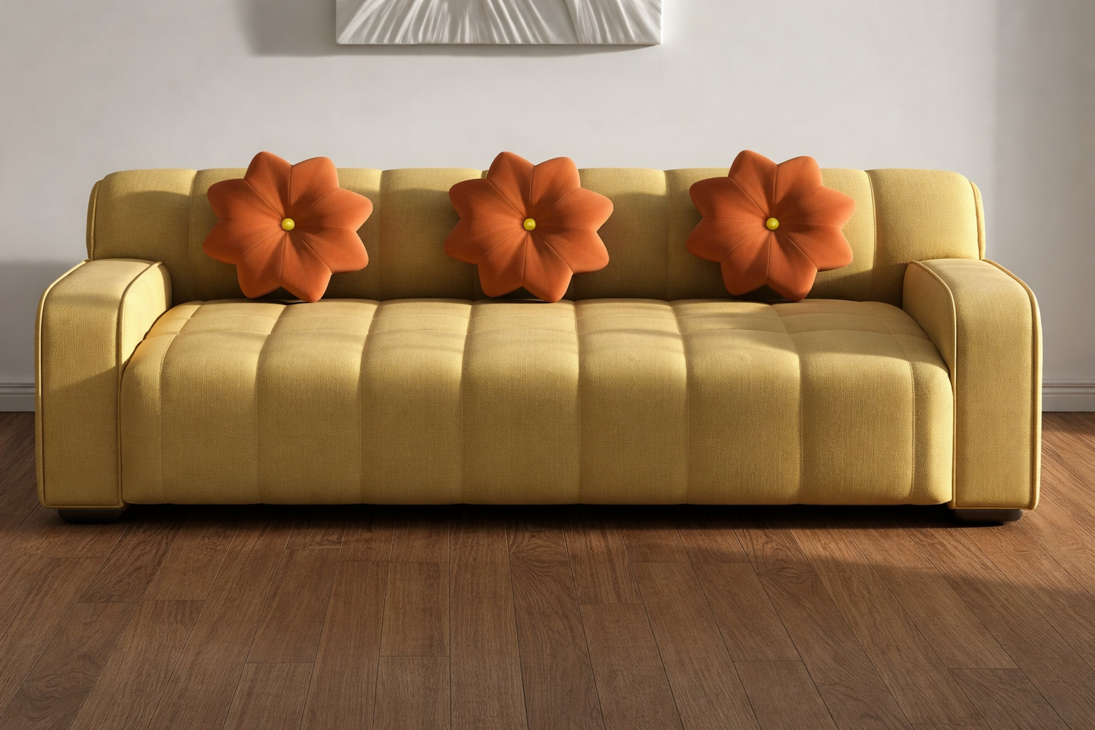 Beige sofa with orange floral cushions in a room with wooden flooring and a light gray wall.