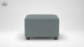 Gray ottoman with wooden legs on a white background