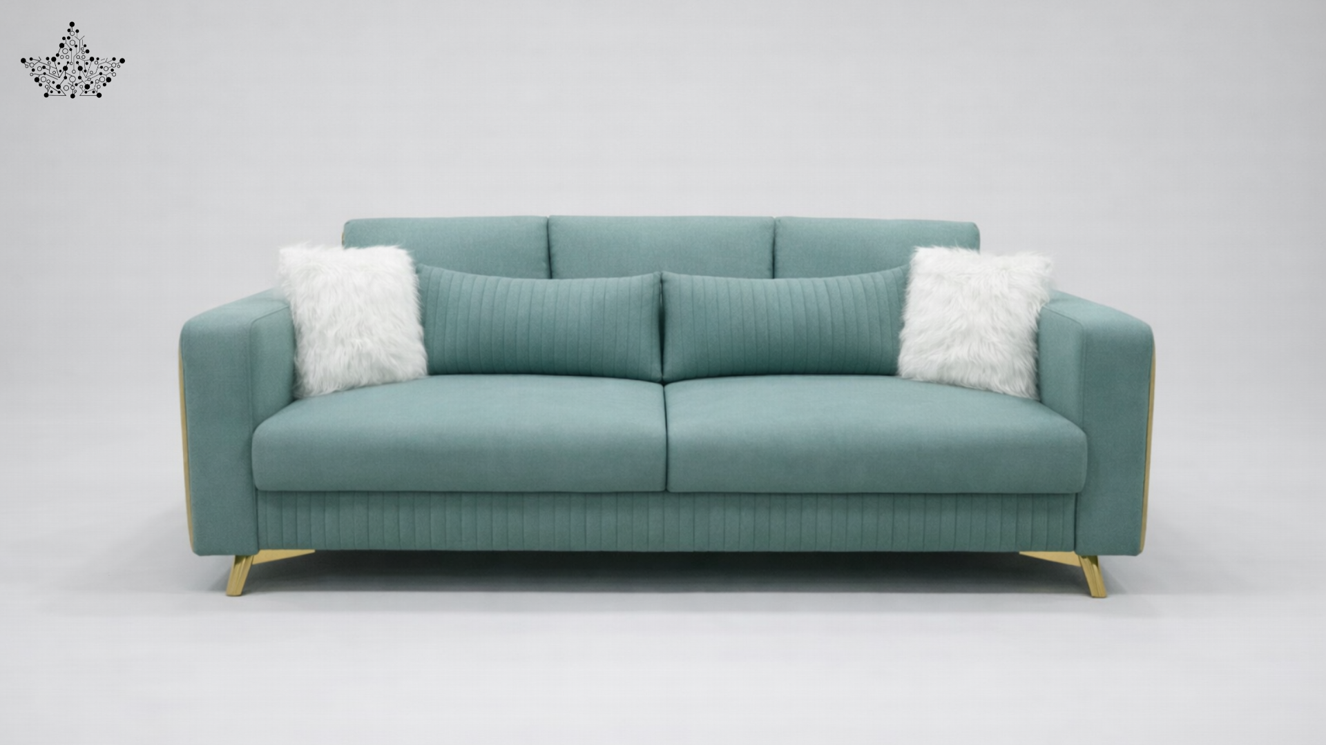 Teal sofa with gold legs on a light gray background