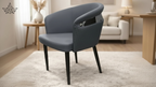 Gray chair in a modern living room setting with a neutral color palette.