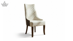 White upholstered chair with quilted design on a white background