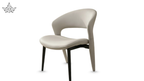 Modern chair with beige seat and backrest on a white background