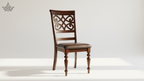 Wooden chair with intricate back design on a white background