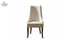 White upholstered chair with quilted backrest on a white background