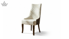Beige upholstered chair with wooden legs on a white background