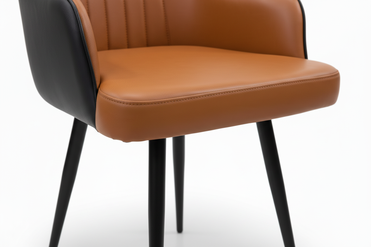 Brown chair with black legs on a tiled floor
