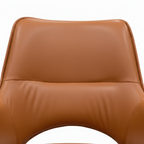 Brown leather chair with black legs on a white background