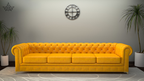 Yellow sofa in a room with a clock on the wall and plants.