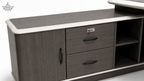 Gray office desk with storage drawers and a cabinet