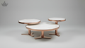Three nested round nesting tables with white marble-look tops and rose gold metal bases, shown on a neutral gray background.